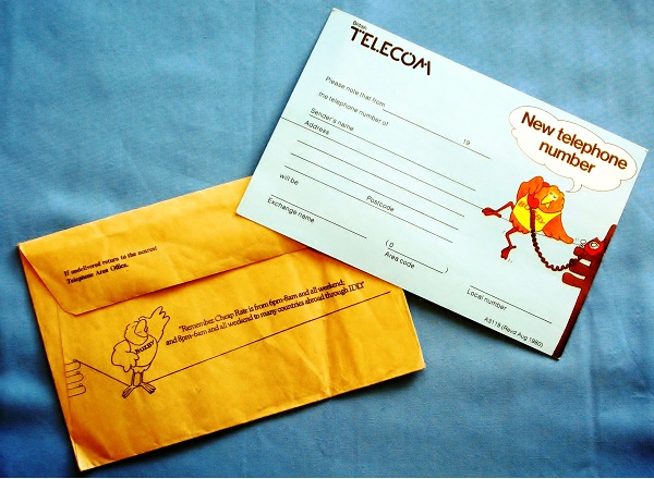 A picture showing a BT envelope with Buzby on the back and a card for notifying poeple that you have changed your telephone number.