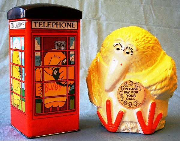 A picture of two Buzby money boxes, one in the shape of a telephone kiosk