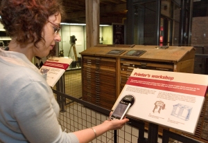 A visitor using miGuide to scan an object